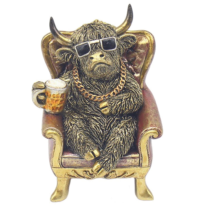 Dudes Highland Cow relaxing in an armchair with pint