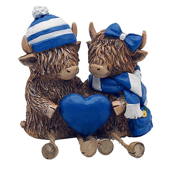 Happy Highland Cow Couple with Blue and White Hats and Scarves