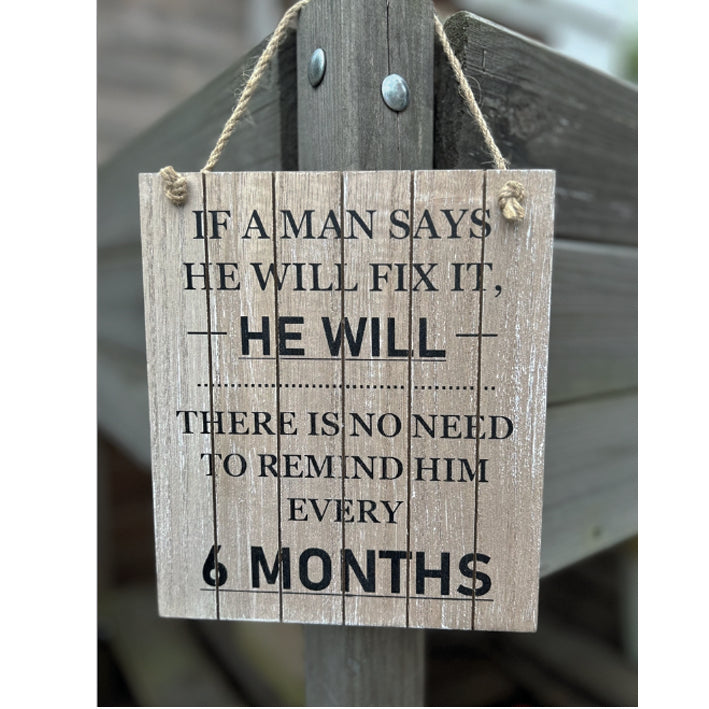 Hanging wooden sign. If a man says he will fix it...
