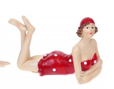 Beach Glamour Girl lying in red polka dot costume