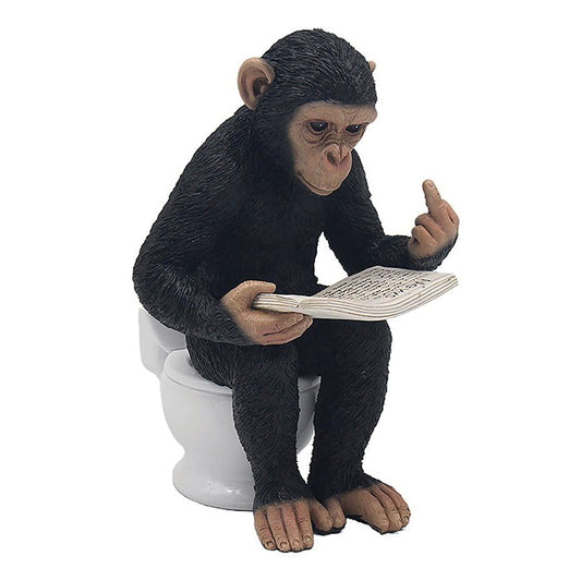 Cheeky Monkey Chimp sitting on loo reading