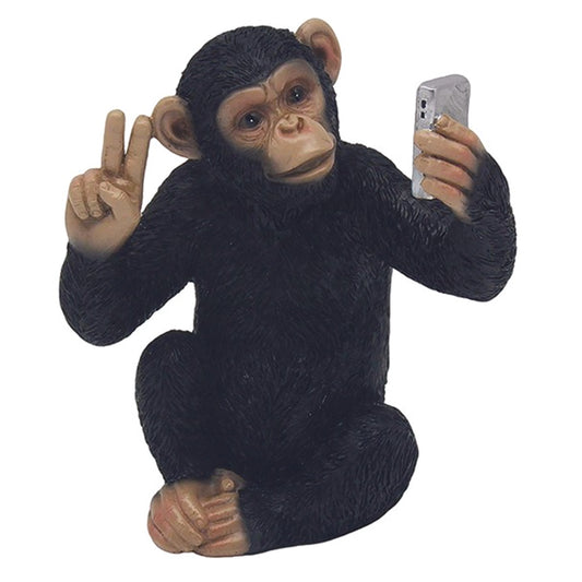 Cheeky Monkey Chimp Sitting Giving the Peace Sign Whilst Taking a Selfie