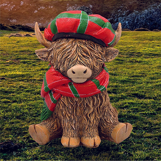 Happy Highland Cow with a tartan hat and scarf
