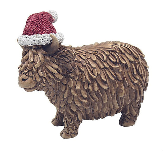 Happy Highland Cow with a Christmas Santa Hat on his head