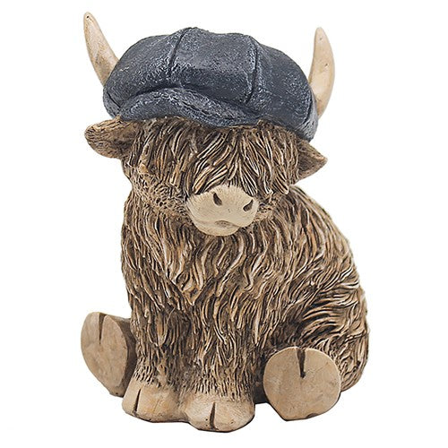 Happy Highland Cow with a black flat cap on his head