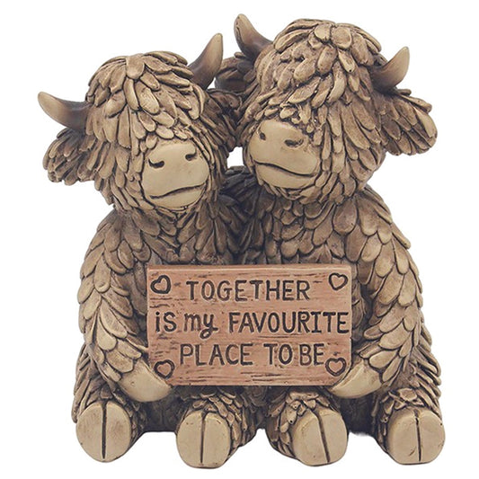 Hughie the Highland Cow couple Holding sign reading Together is my favourite place to be