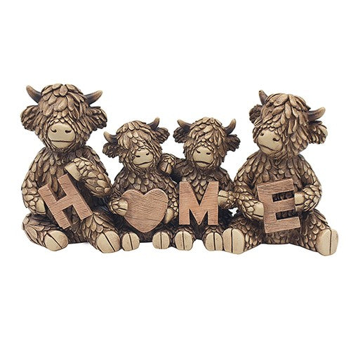 Hughie the Highland Cow and family holding HOME letters ornament