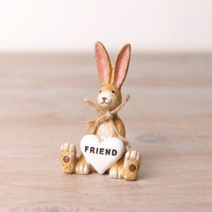 Jasper the Rabbit ornament holding a white heart saying Friend