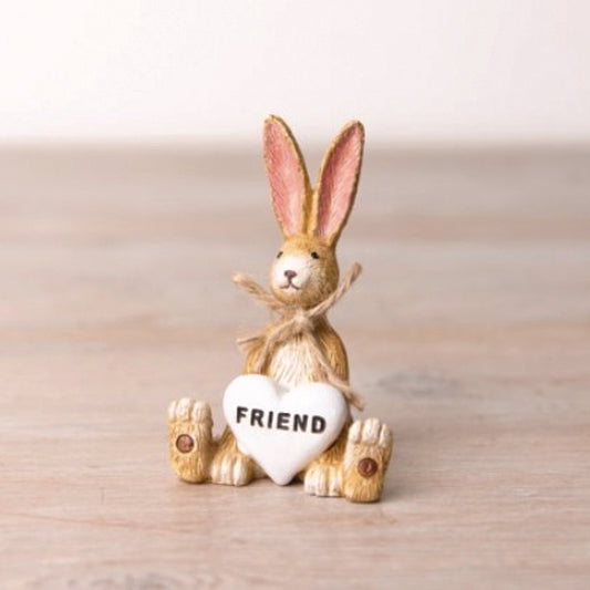Jasper the Rabbit ornament holding a white heart saying Friend