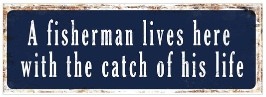 Large metal sign - A fisherman lives here with the catch of his life