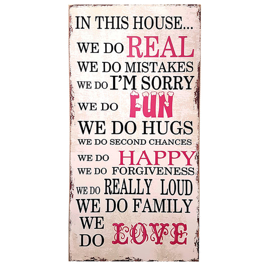 Large wooden sign. In our house we do real....
