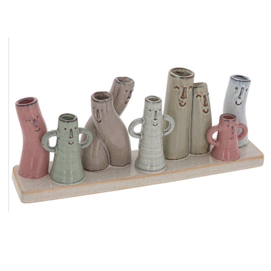 Petite Pottery 9 mini stem vases  with faces on a base
