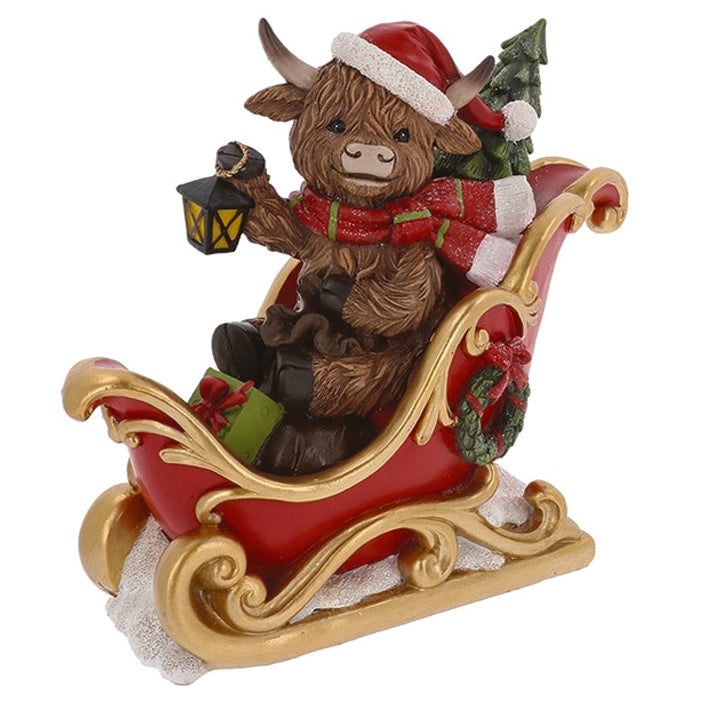 Christmas Highland Cow in a Sleigh