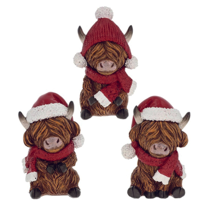 Christmas Highland Coos with red hats and scarves