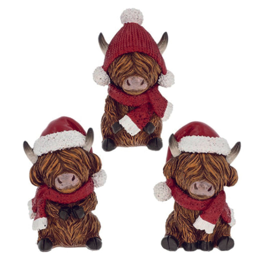 Christmas Highland Coos with red hats and scarves