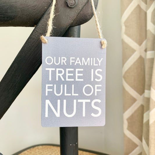 Mini metal sign. Our family tree is full of nuts